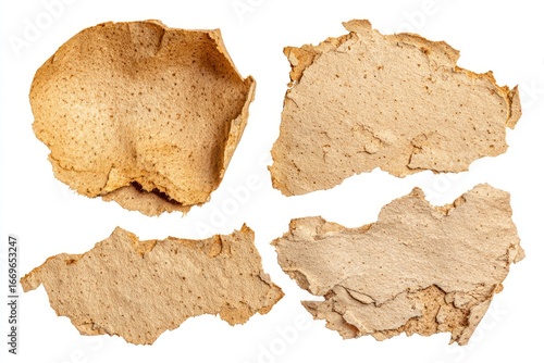 Wallpaper Mural Crumpled, torn pieces of light-brown, textured paper, isolated on white. Rough edges and surface variation add depth and detail Torontodigital.ca
