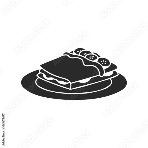 Black and white silhouette of a lasagna slice on plate with tomato garnish