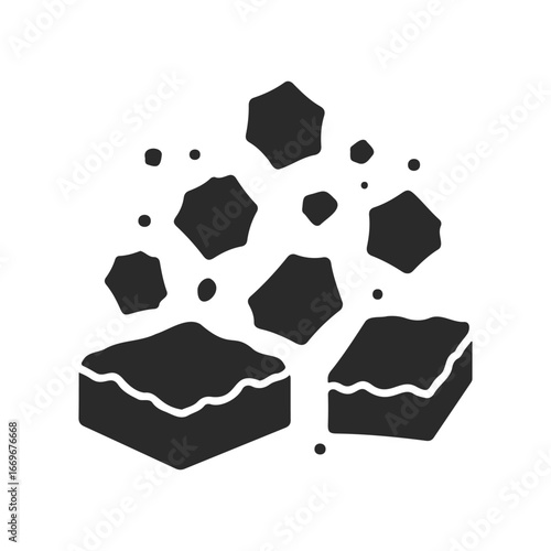Black sponge icon with floating particles