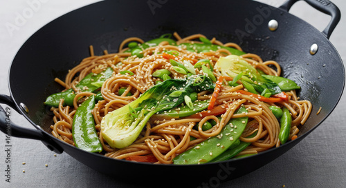 Delicious Asian Noodle StirFry with Vegetables and Sesame Seeds in Wok.