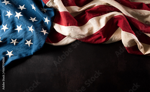 Happy Veterans Day concept. American flags against a dark stone  background. November 11.