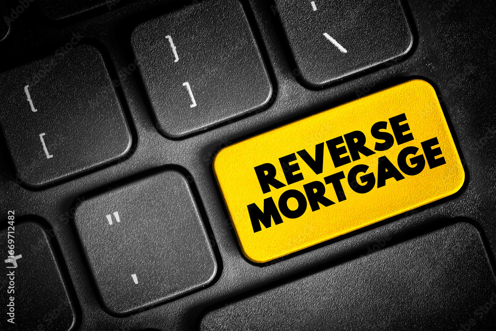 Fototapeta premium Reverse Mortgage - secured by a residential property, that enables the borrower to access the unencumbered value of the property, text concept button on keyboard