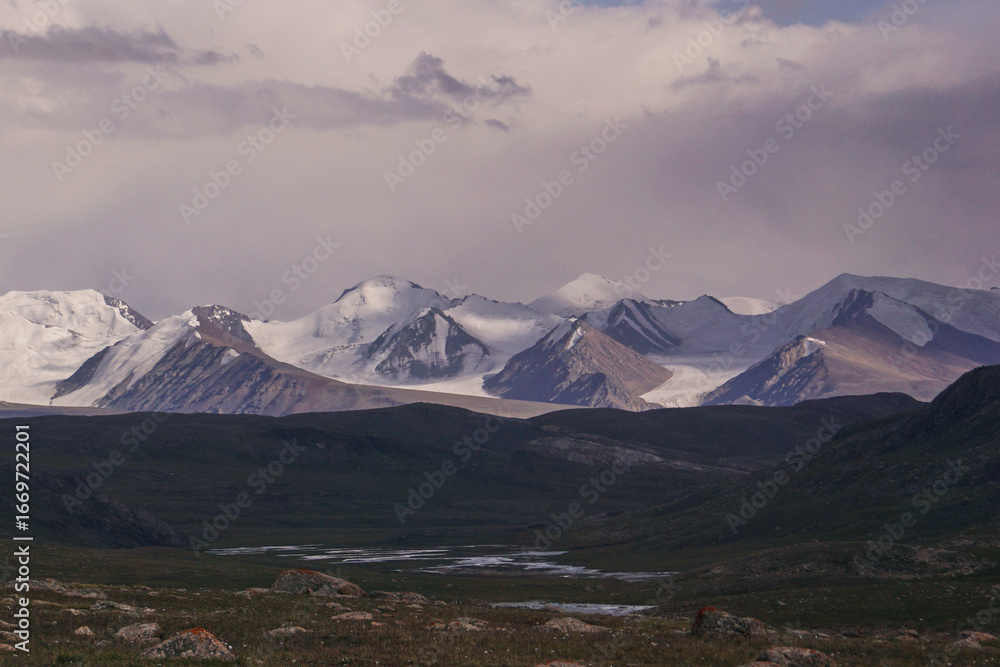 Fototapeta premium a mountain range covered with snow and glaciers. Mountain panorama