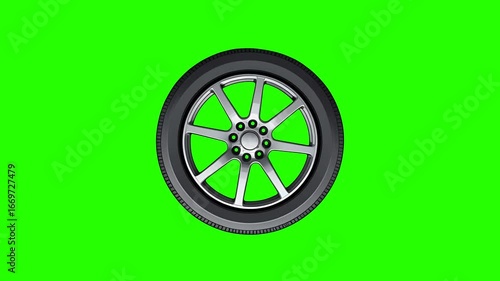 A studio shot of a stylish car wheel Animation with a gray metallic finish set against a bright lime green screen background.