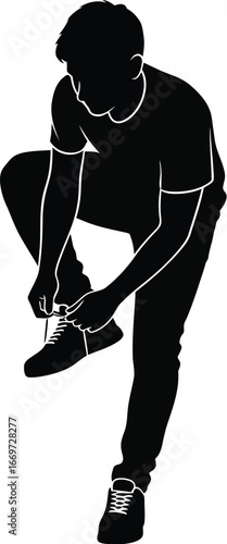 Silhouette of a man tying his shoelaces, capturing a moment of preparation and focus before an activity