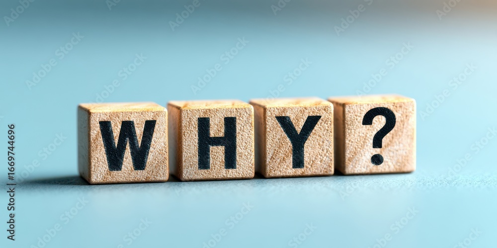 Fototapeta premium The wooden blocks spelling WHY with question mark on blue background