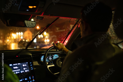 Night Driving in the Rain Through Car Windshield