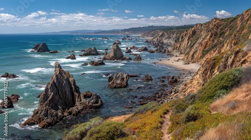 Serene Coastal Landscape with Rocky Outcrops and Turquoise Waters Under Scenic Cloudy Sky