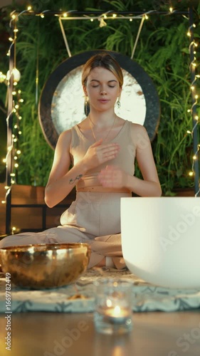 Woman practicing deep breathing during sound meditation