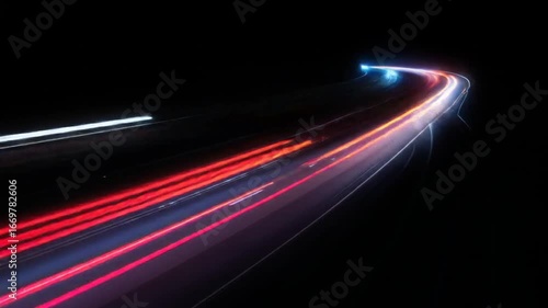 Night highway lights streaking in a curve