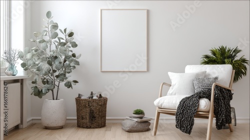 Blank picture frame mockup on white wall. White living room design. View of modern scandinavian style interior with artwork mock up on wall. Home staging and minimalism concept.