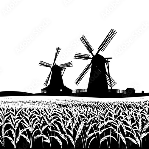 Silhouette of two windmills in a field with wheat in black and white