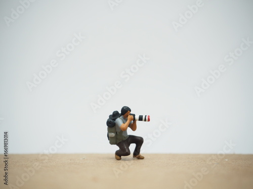 Foto Mini toy of action figure at outdoor with blurred background