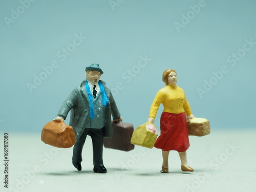 Obraz na plátně Mini toy of action figure at table with blurred background