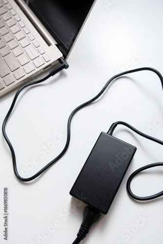 Wallpaper Mural Charging laptop with power adapter isolated on white background Torontodigital.ca