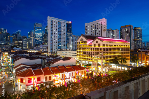 Chinatown in Singapore lights up during the Chinese New Year and Mid-Autumn Festival, creating a beautiful night scene in the city.