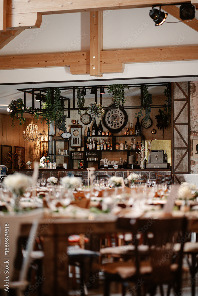 Naklejka premium Rustic boho wedding with couple, decorations, flowers and celebration in vintage barn