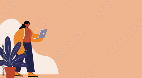 Professional woman focused on her laptop, embodying remote work, online education, or digital communication in a contemporary space.