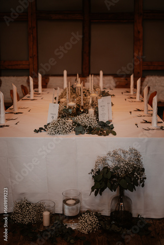 Rustic boho wedding with couple, decorations, flowers and celebration in vintage barn