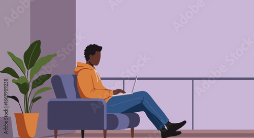 Young person working or studying remotely on a laptop from the comfort of their home, depicting a modern digital lifestyle.