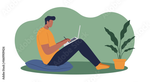 A focused man comfortably works remotely on his laptop with a stylus, embodying modern productivity, flexible lifestyle, and digital creative work from home.