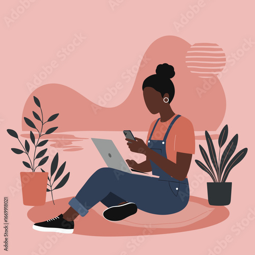 Young Black woman multitasking with laptop and smartphone, embodying remote work, digital communication, and a modern connected lifestyle.