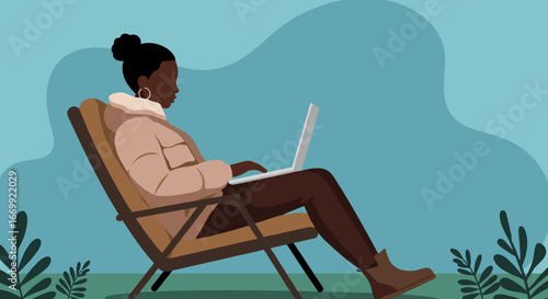 Relaxed Black woman working remotely on laptop in a lounge chair outdoors, symbolizing freedom, productivity, and modern work-life balance.