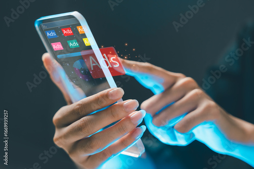 Futuristic concept of digital advertising on mobile device. A person interacts with virtual ads using a transparent smartphone interface, symbolizing online marketing and ad technology.