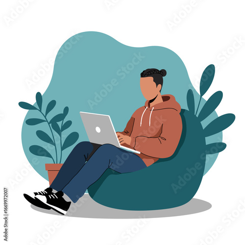 Person working remotely on a laptop while relaxing comfortably on a bean bag chair at home. Concept of flexible work, freelance, online education, or leisure.