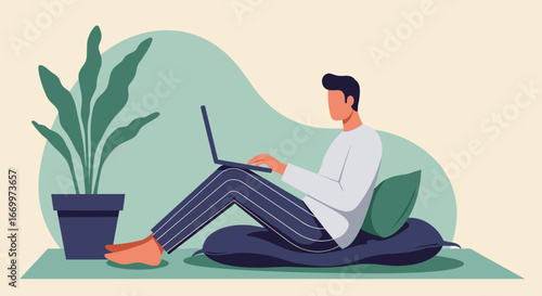 Relaxed man working remotely from home, using a laptop on comfortable cushions. Ideal for concepts of freelancing, online learning, or flexible work lifestyle.