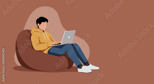 Young person focused on laptop while relaxing on a comfortable bean bag chair. Depicts remote work, online learning, or casual lifestyle.