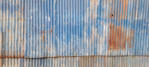 Old zinc vintage fence wall texture for background, pattern of rusty on metal panel.Tin Roof wall countryside