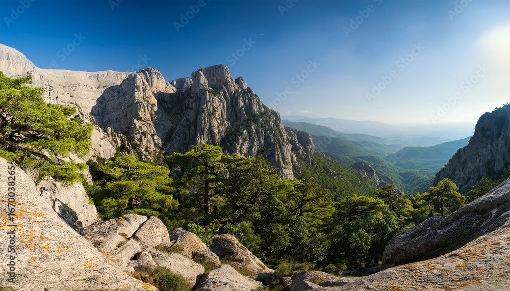 Fototapeta premium olympus surrounded by rocky cliffs and dense green forest vegetation