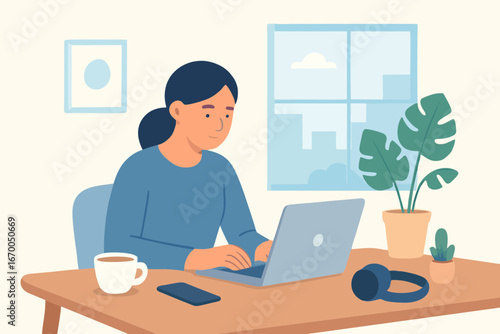 Woman working on laptop at home desk with coffee cup, concept of freelance and productivity.