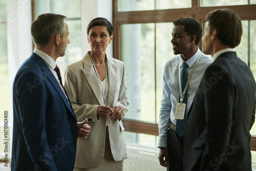 Fotografija Middle aged Caucasian woman and three middle aged men, including one Black man a