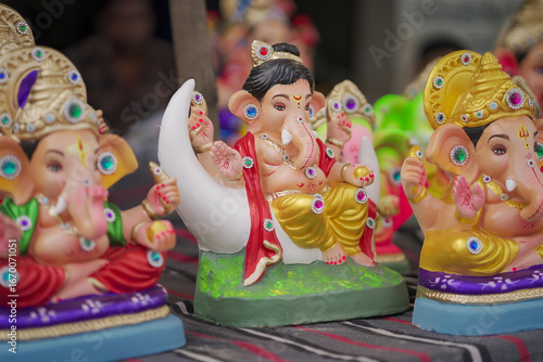 Photography Lord Ganesha idol for Ganesh Chaturthi festival in India, Colorful Ganpati statue Stock Photo, Lord Ganesha murti