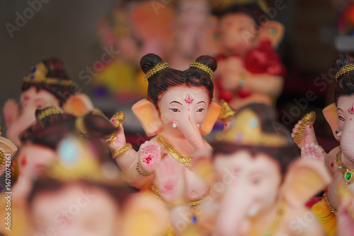Photography Lord Ganesha idol for Ganesh Chaturthi festival in India, Colorful Ganpati statue Stock Photo, Lord Ganesha murti