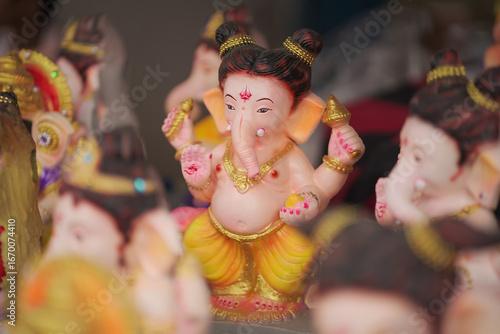 Photography Lord Ganesha idol for Ganesh Chaturthi festival in India, Colorful Ganpati statue Stock Photo, Lord Ganesha murti