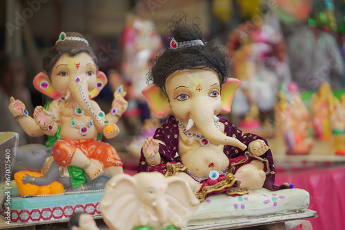 Photography Lord Ganesha idol for Ganesh Chaturthi festival in India, Colorful Ganpati statue Stock Photo, Lord Ganesha murti