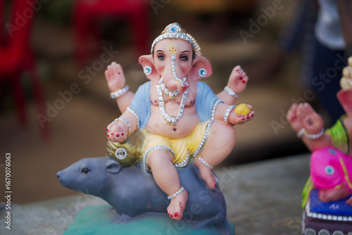 Photography Lord Ganesha idol for Ganesh Chaturthi festival in India, Colorful Ganpati statue Stock Photo, Lord Ganesha murti