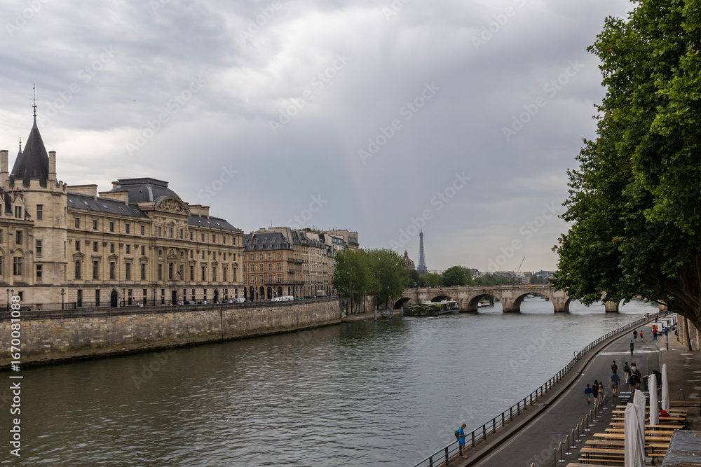 Fototapeta premium Paris, bridge over the Seine river, historical architecture on the streets of the city. Paris, France