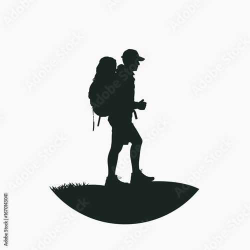 Silhouette of a hiker with backpack on a hilltop