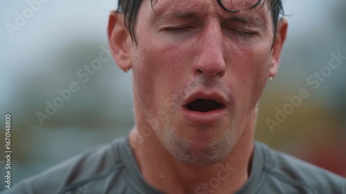 Muscular athlete dripping sweat, gasping after grueling workout, displaying raw fitness commitment and physical limits