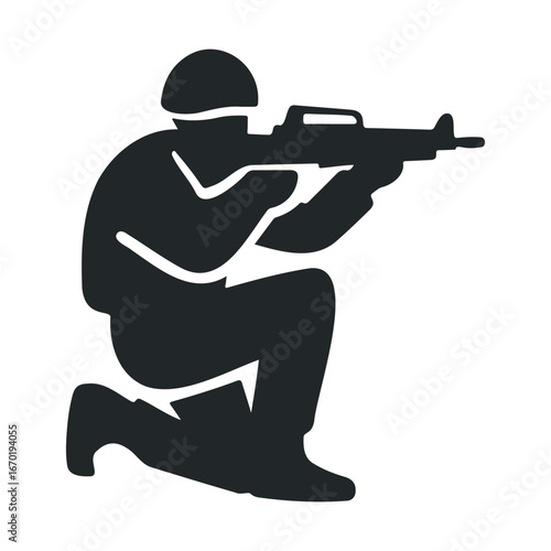 Silhouette of armed soldier kneeling with rifle in combat position
