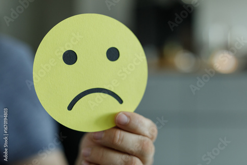 A person holds up a yellow ...