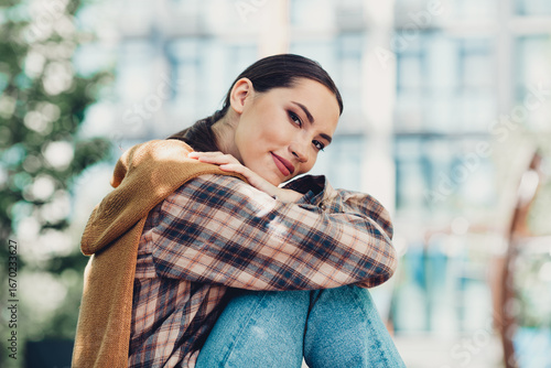 Wallpaper Mural Young woman outdoors enjoys a leisure walk on a sunny day in the city while dressed in stylish casual attire Torontodigital.ca