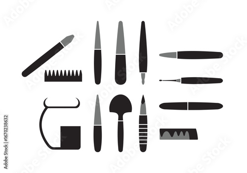 Assorted grooming tools are arranged on a white surface