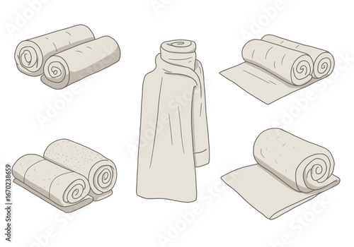 Beige folded and rolled towels surround a garment neutral tones