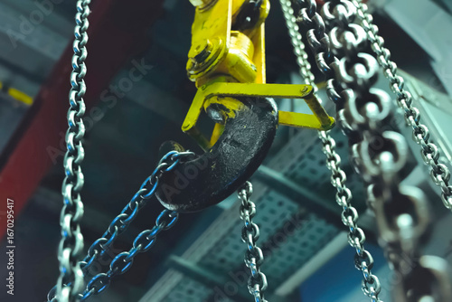 Lifting chains for hoisting cargo with crane hook. Chain on the hook.