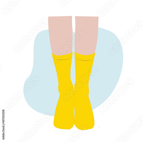 feet wearing yellow socks. Pairs of feet in socks 